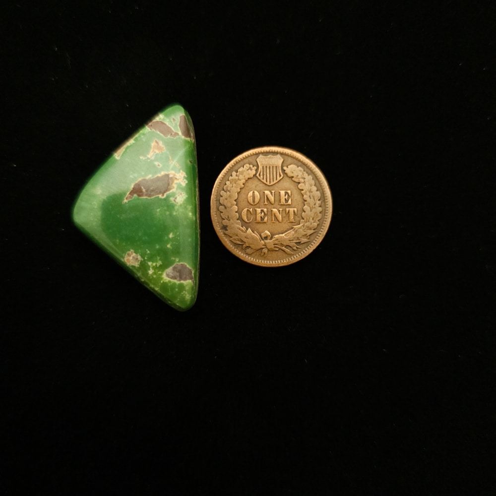 "23.85-Carat Dark Green Triangular Turquoise Cabochon with Black Chert from Grasshopper Mine on TurquoiseDeluxe."