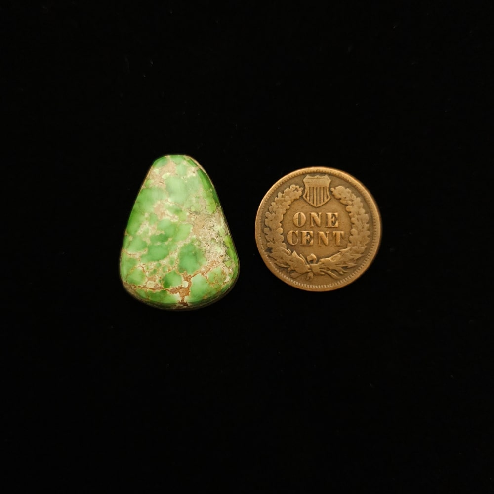 "Bright Green Triangular Turquoise Cabochon with Golden Spider Web Matrix from Grasshopper Mine on TurquoiseDeluxe."