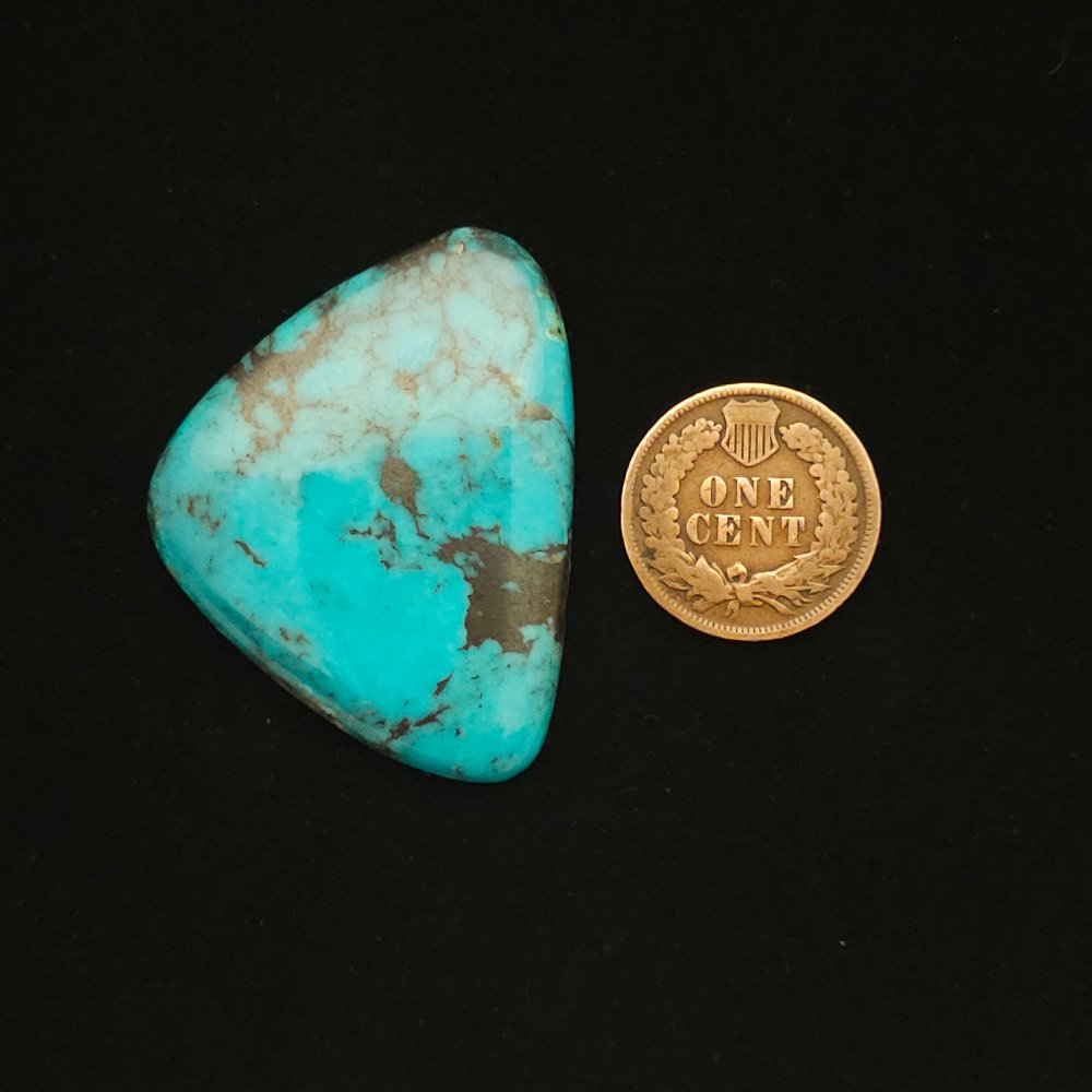 "Bright Blue Triangle Nacozari Mine Turquoise Cabochon with Rounded Points and Chocolate Brown Matrix, 52.40 Carats, 40.46mm x 31.42mm, Stabilized, from Nacozari Mine on Turquoise Deluxe"