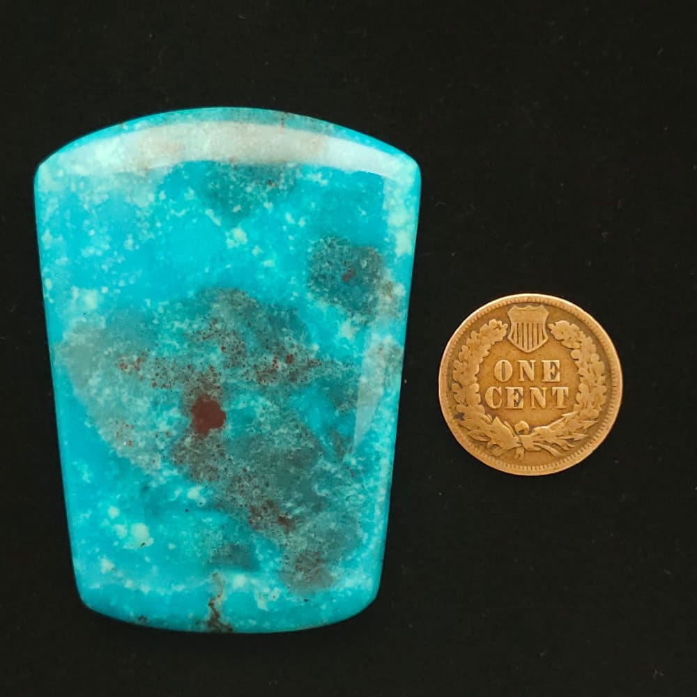 "Azure Radiance Shield-Cut Nacozari Mine Turquoise Cabochon with Cosmic Red Cuprite and White Wisps, 115.75 Carats, 54.76mm x 40.49mm, Stabilized, from Nacozari Mine on Turquoise Deluxe"