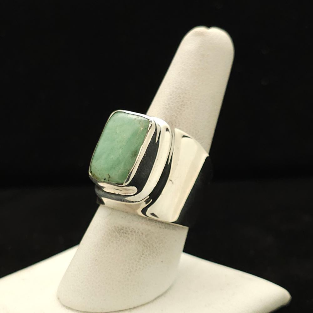 "A modern, heavy silver ring featuring a chrysoprase stone, size 8.5, part of the Ethnographic line by Turquoise Deluxe."