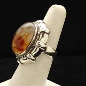 "A heavy silver ring featuring an oval symbol agate stone from Indonesia, size 7, part of the Ethnographic line by Turquoise Deluxe."