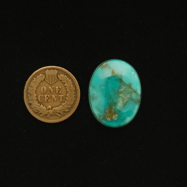 Vintage Godber-Burnham turquoise cabochon, 17.85 carats, oval-shaped, featuring ocean blue color with golden brown matrix, hand-cut from 1970s Nevada rough.