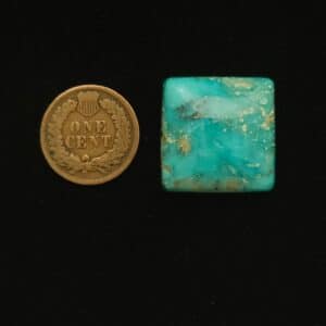 Vintage Godber-Burnham turquoise cabochon, 37.50 carats, rectangular, with ocean blue hues, wisps of black, and mocha matrix, hand-cut from 1970s Nevada rough.