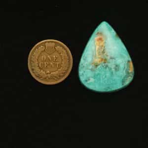 Teardrop-shaped Godber-Burnham turquoise cabochon in ocean froth blue with golden matrix, 33.05 carats