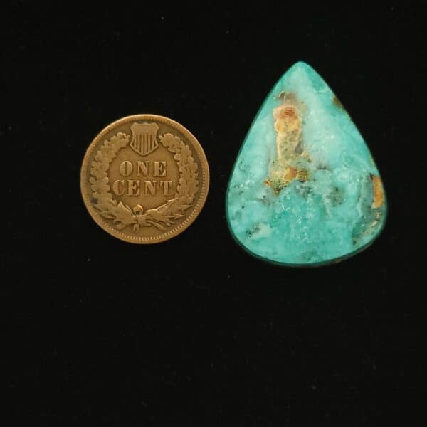Teardrop-shaped Godber-Burnham turquoise cabochon in ocean froth blue with golden matrix, 33.05 carats
