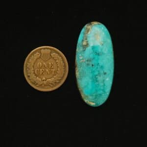 Oval Godber-Burnham turquoise cabochon in sky blue with mocha and black matrix, 32.60 carats