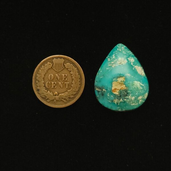 Teardrop-shaped Godber-Burnham turquoise cabochon in ocean blue with mocha matrix, 28.45 carats