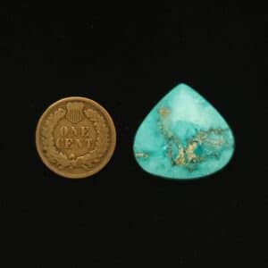 Teardrop-shaped Godber-Burnham turquoise cabochon in light sky blue with black and mocha matrix, 24.75 carats