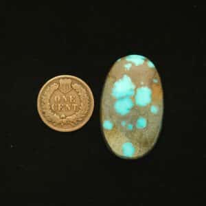 Oval Godber-Burnham turquoise cabochon in sky blue with golden brown matrix, 32.25 carats
