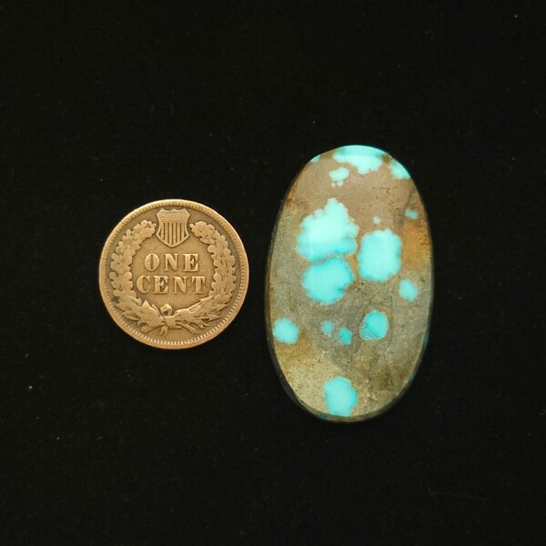 Oval Godber-Burnham turquoise cabochon in sky blue with golden brown matrix, 32.25 carats