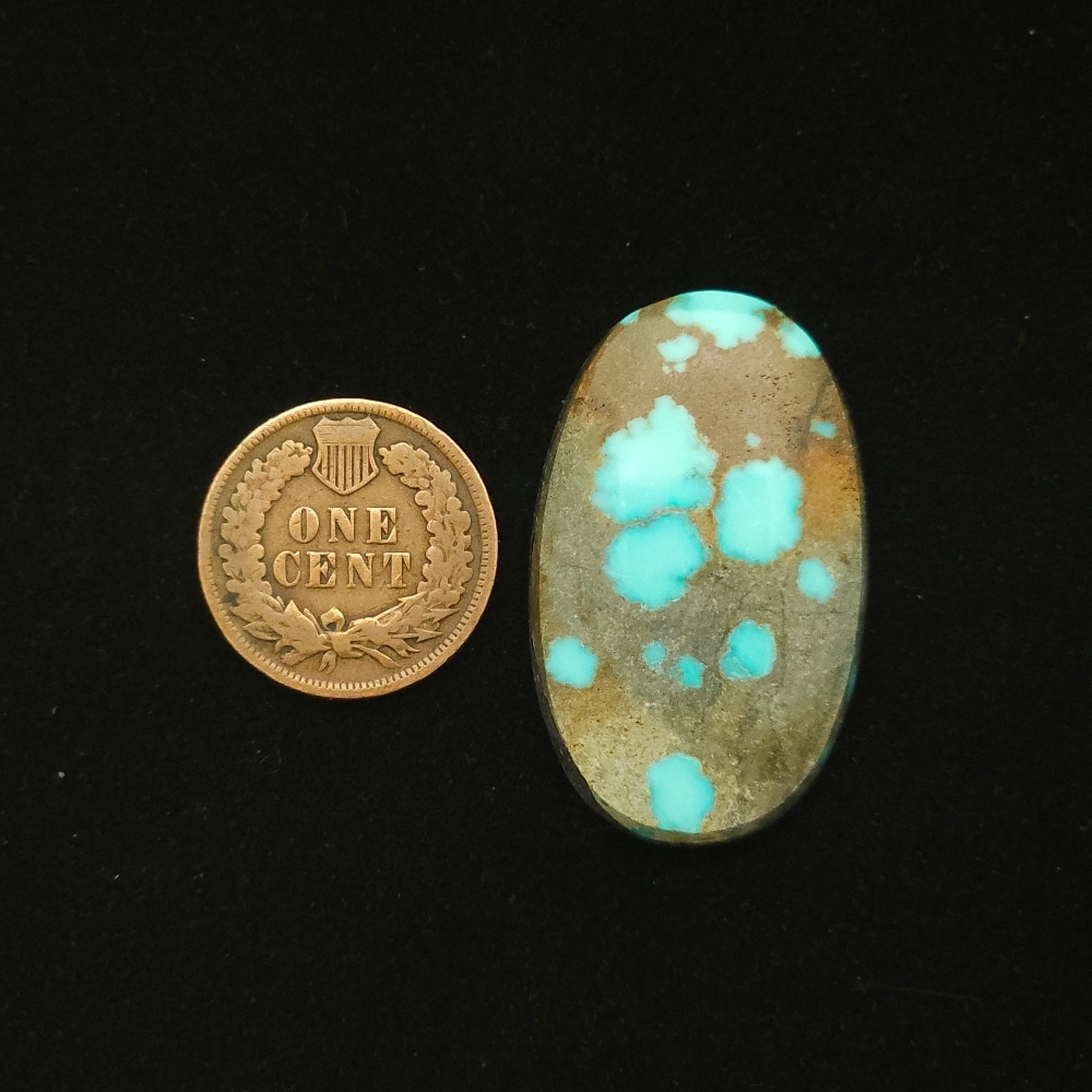 Oval Godber-Burnham turquoise cabochon in sky blue with golden brown matrix, 32.25 carats