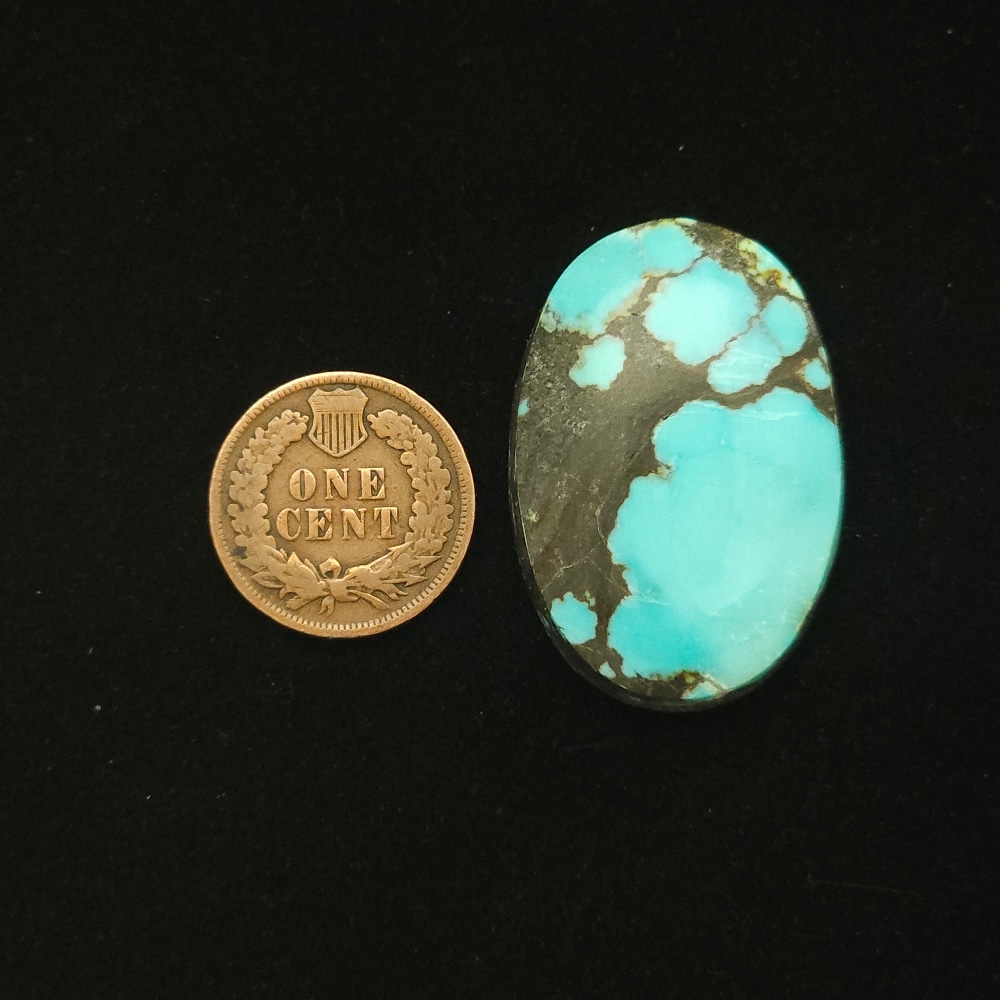 Oval Godber-Burnham turquoise cabochon in sky blue with lightning bolt black matrix, 51.70 carats