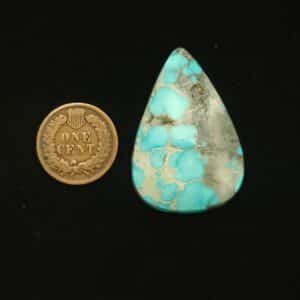 Natural Godber-Burnham turquoise cabochon, 52.50 carats, sky blue with black and grey spiderweb matrix