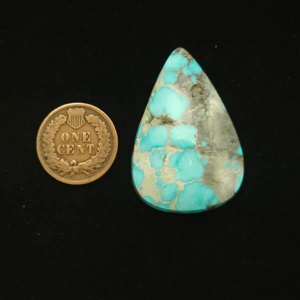Natural Godber-Burnham turquoise cabochon, 52.50 carats, sky blue with black and grey spiderweb matrix
