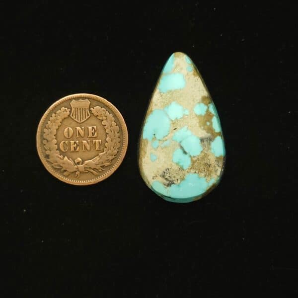 Natural Godber-Burnham turquoise cabochon, 23.50 carats, teardrop shape, sky blue with coffee and cream spiderweb matrix