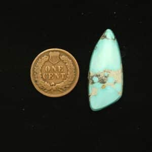 Natural Godber-Burnham turquoise cabochon, 18.80 carats, irregular teardrop shape, pastel sky blue with white and black matrix