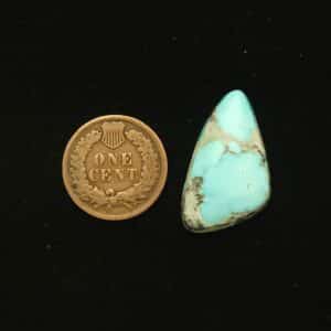 Natural Godber-Burnham turquoise cabochon, 16.70 carats, isosceles triangle shape, sky blue with black and grey wispy matrix