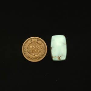 Dry Creek turquoise cabochon, 12.95 carats, tapered rectangle shape, pale blue with ochre matrix