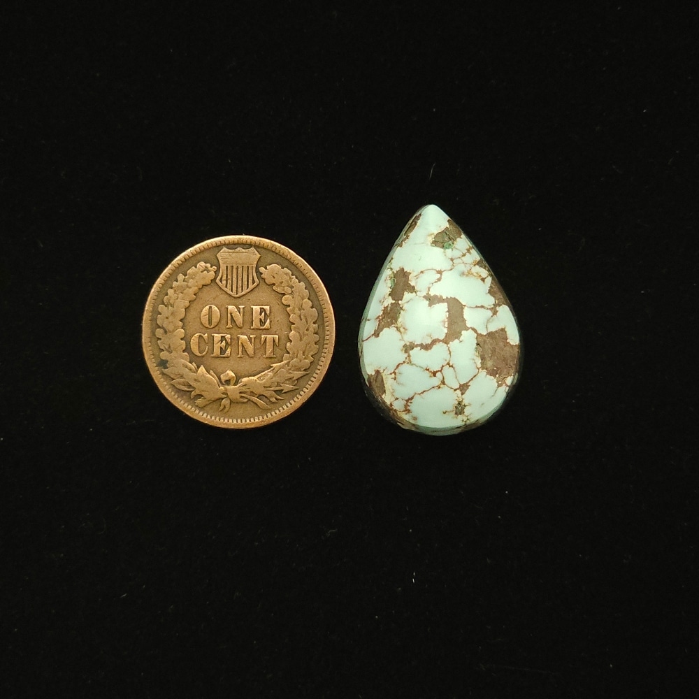 Dry Creek turquoise cabochon, 17.50 carats, teardrop shape, pale blue with chocolate spiderweb matrix