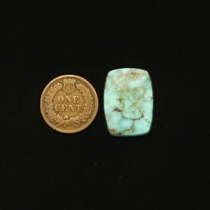 Dry Creek turquoise cabochon, 15.60 carats, tapered rectangle shape, pastel blue with ochre webbing