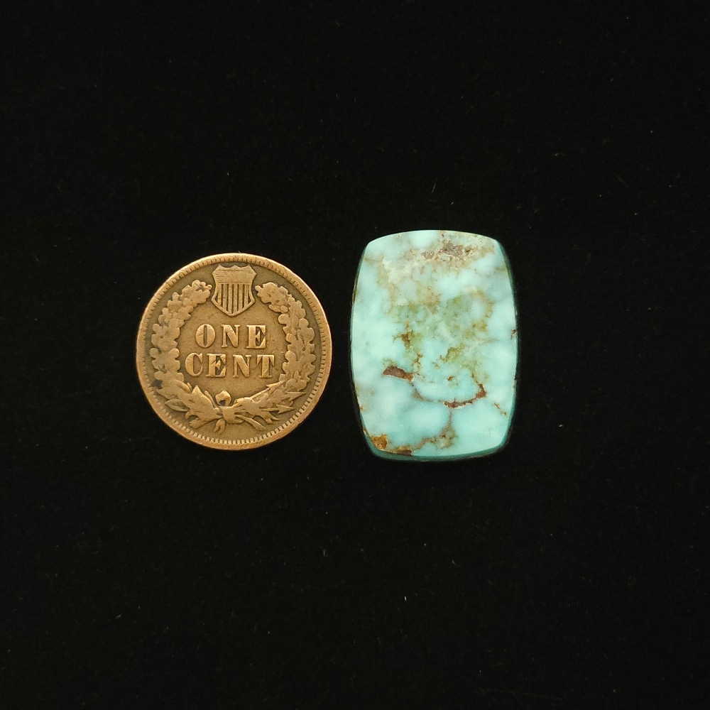 Dry Creek turquoise cabochon, 15.60 carats, tapered rectangle shape, pastel blue with ochre webbing